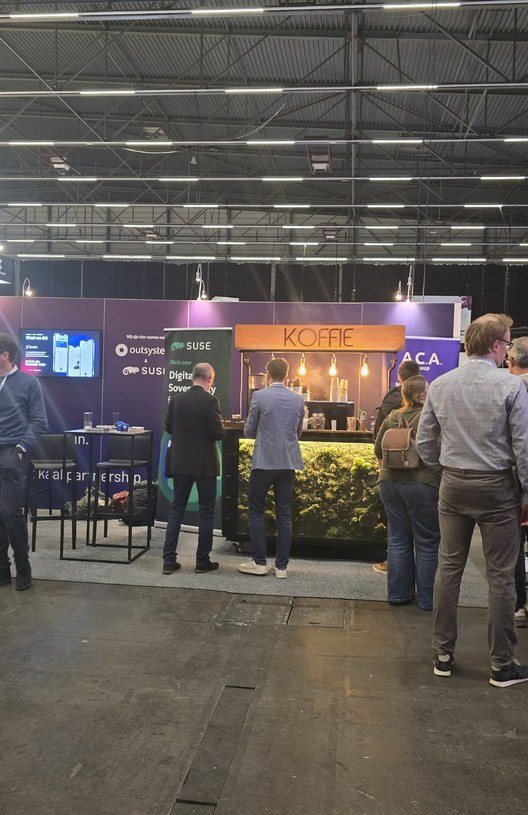 De stand van ACA Group, OutSystems en SUSE op Trefdag Vlaanderen Digitaal 2026