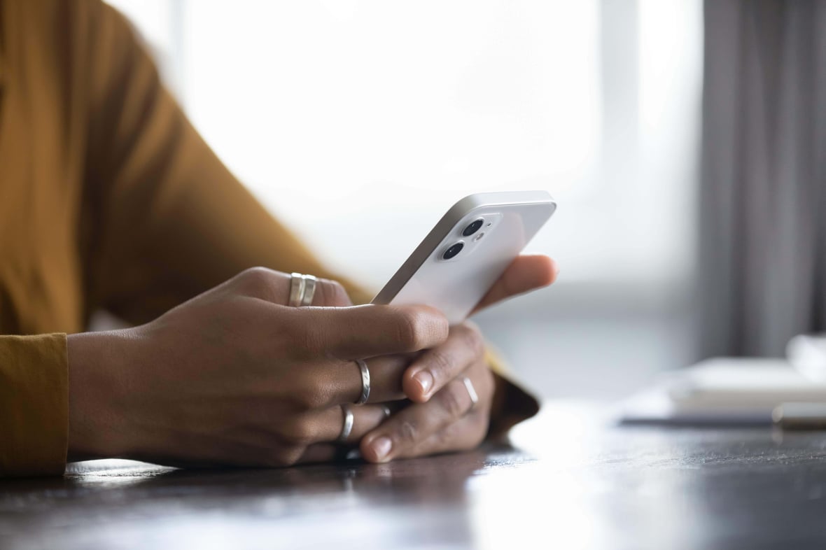 person using their mobile phone person using their mobile phone